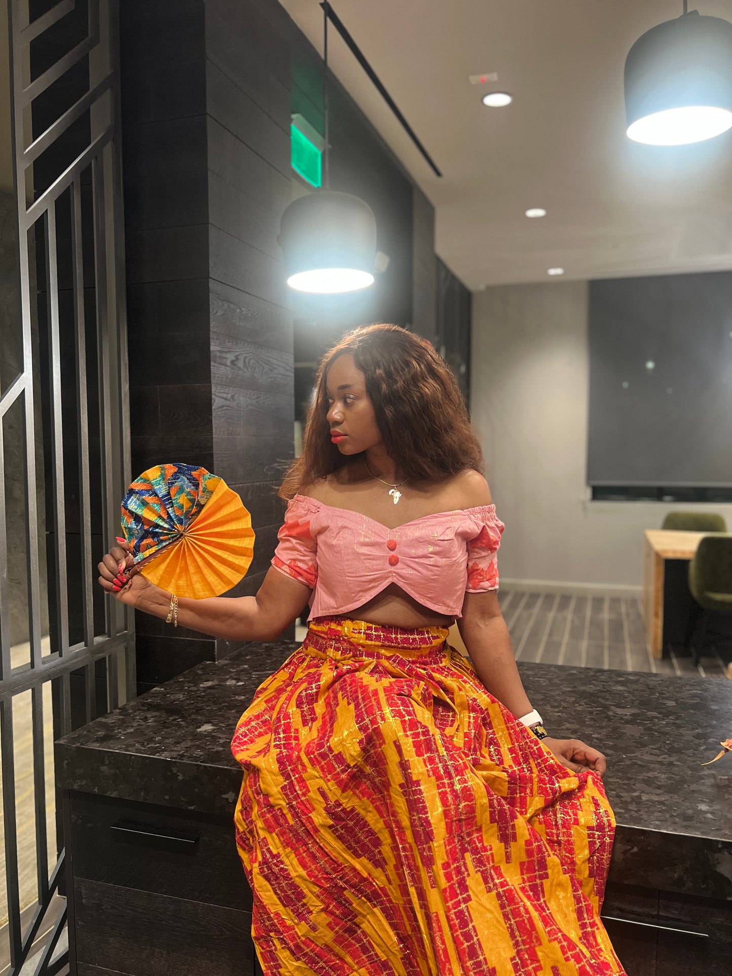 Malayka African printed Maxi Skirt 2 pieces. Skirt with zipper slit on the side, two side pockets and short sleeves crop top. For parties, weddings, birthdays, and major social events.