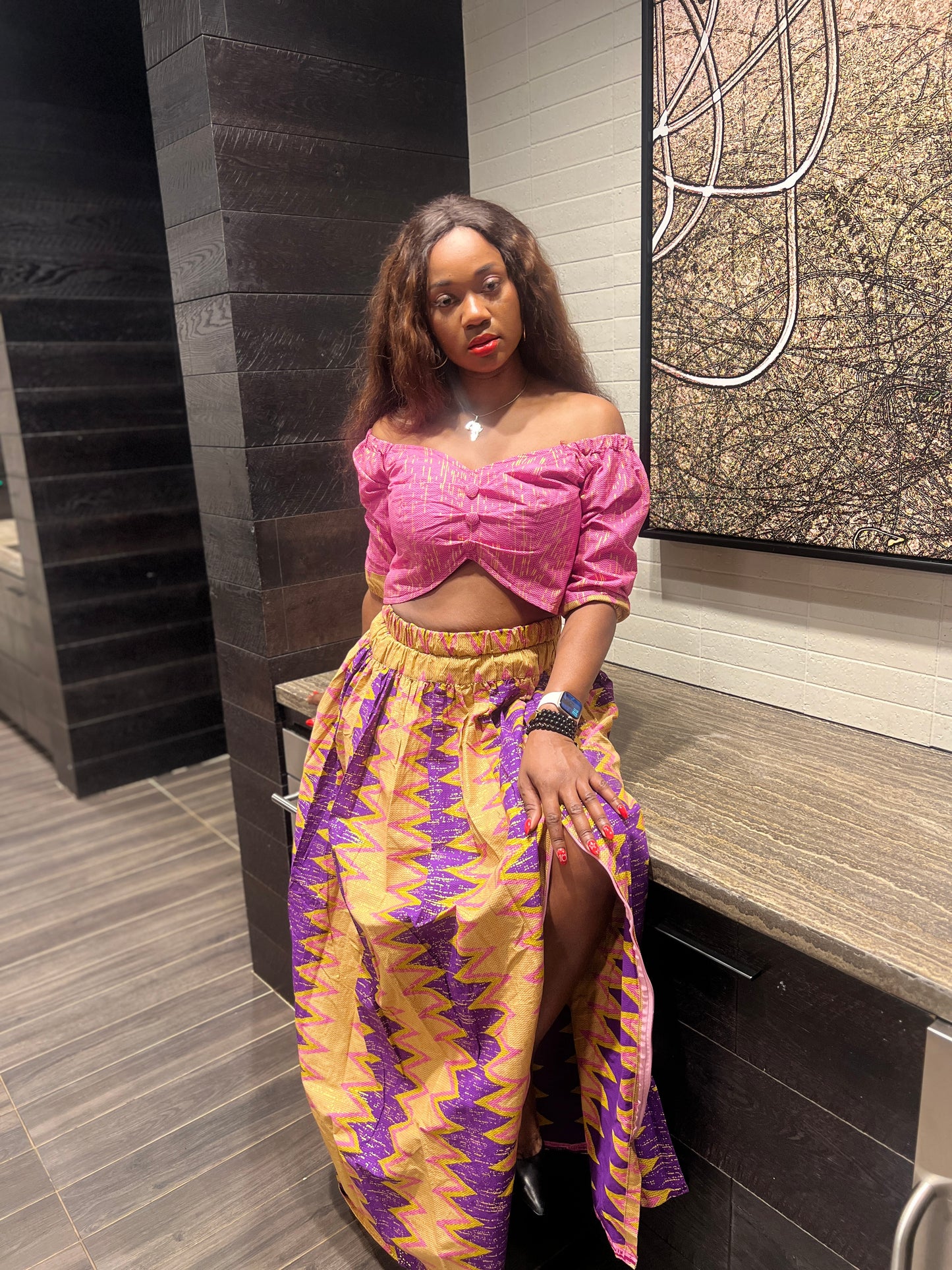 Malayka African printed Maxi Skirt 2 pieces. Skirt with zipper slit on the side, two side pockets and long sleeves crop top. For parties, weddings, birthdays, and major social events.