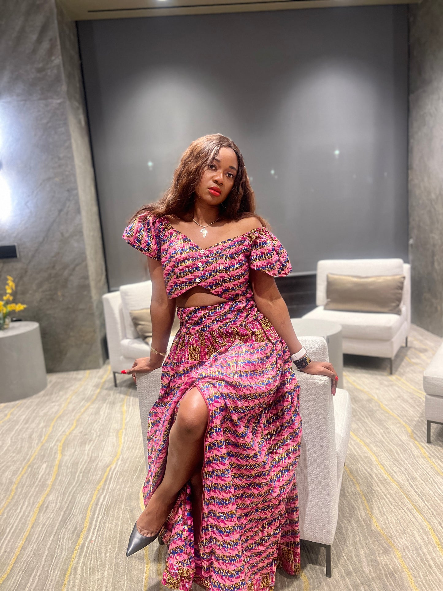 Malayka African printed Maxi Skirt 2 pieces. Skirt with zipper slit on the side, two side pockets and short sleeves crop top. For parties, weddings, birthdays, and major social events.