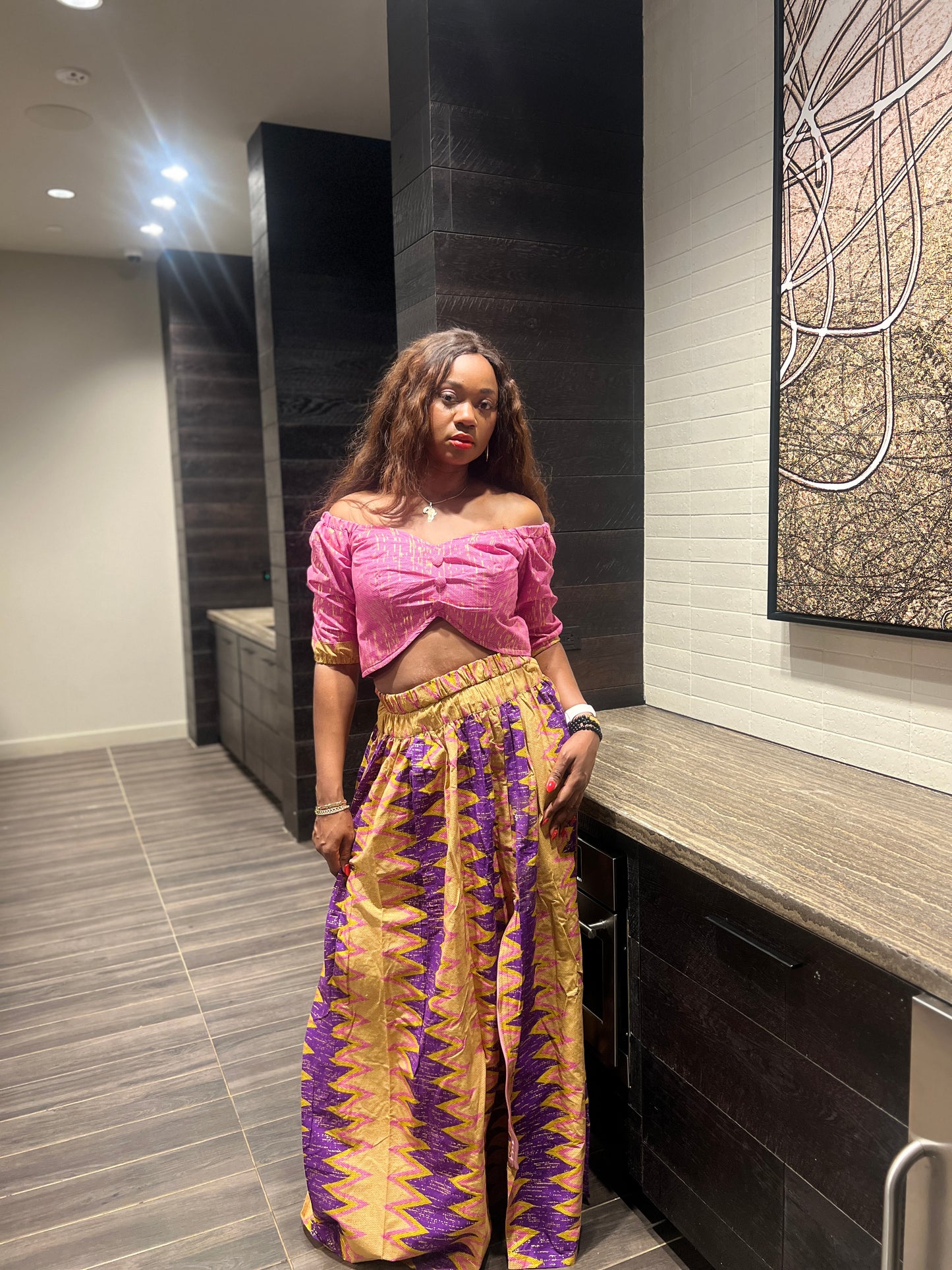 Malayka African printed Maxi Skirt 2 pieces. Skirt with zipper slit on the side, two side pockets and long sleeves crop top. For parties, weddings, birthdays, and major social events.