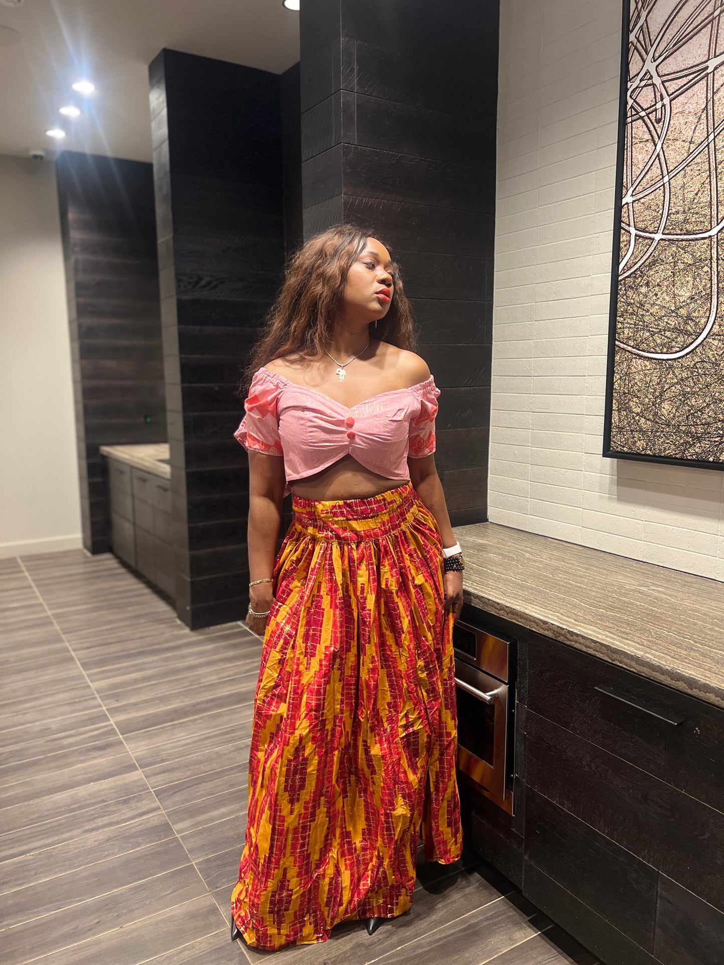 Malayka African printed Maxi Skirt 2 pieces. Skirt with zipper slit on the side, two side pockets and short sleeves crop top. For parties, weddings, birthdays, and major social events.