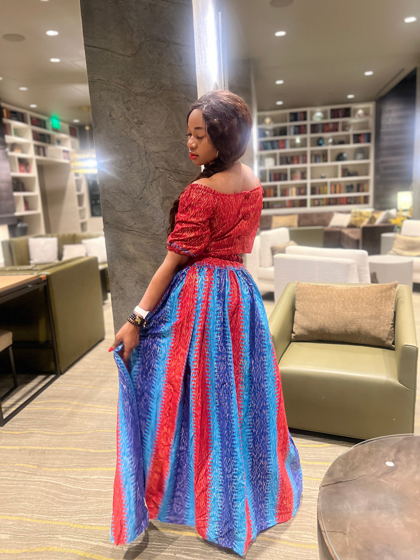 Malayka African printed Maxi Skirt 2 pieces. Skirt with zipper slit on the side, two side pockets and long sleeves crop top. For parties, weddings, birthdays, and major social events.