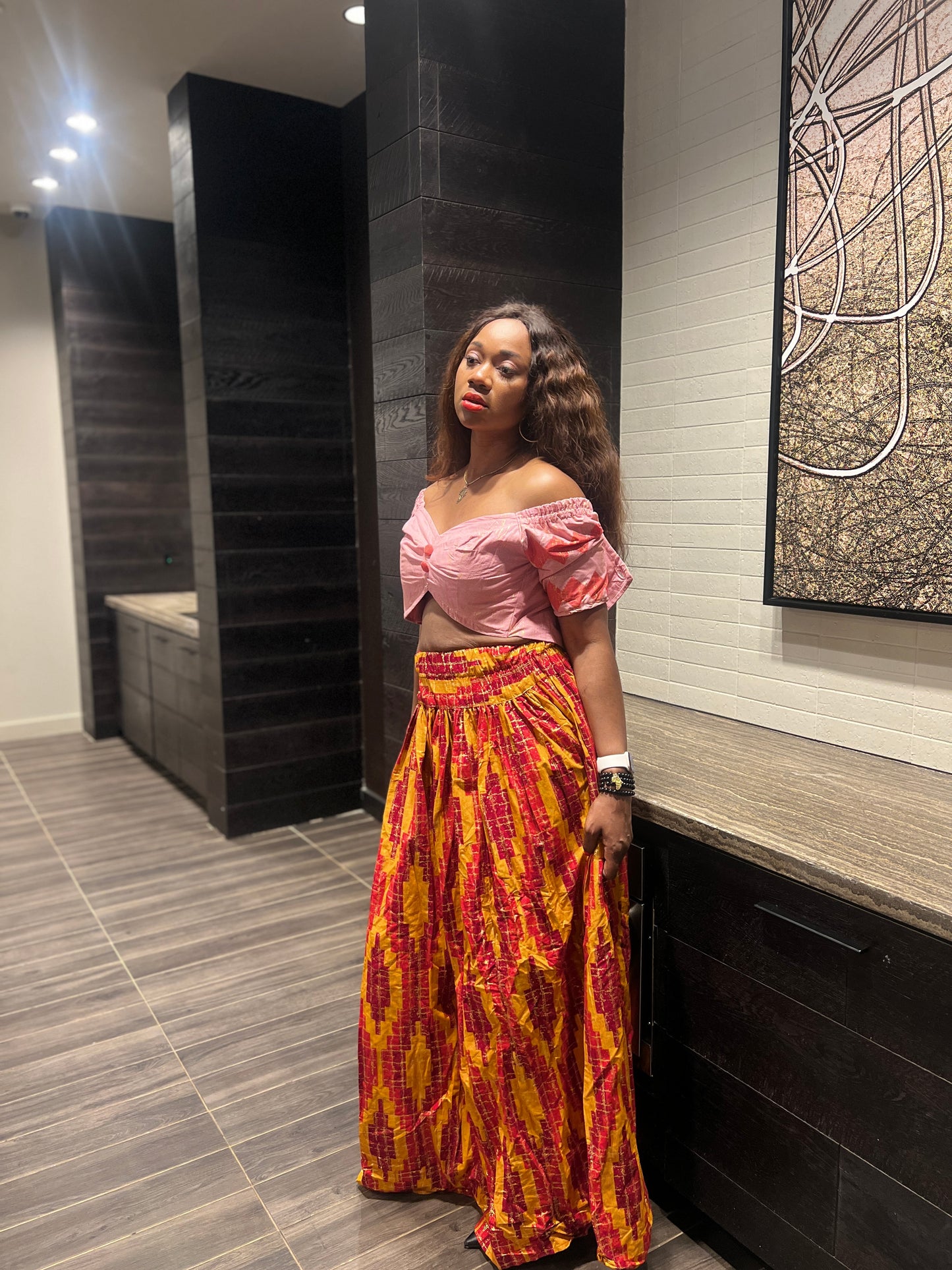 Malayka African printed Maxi Skirt 2 pieces. Skirt with zipper slit on the side, two side pockets and short sleeves crop top. For parties, weddings, birthdays, and major social events.