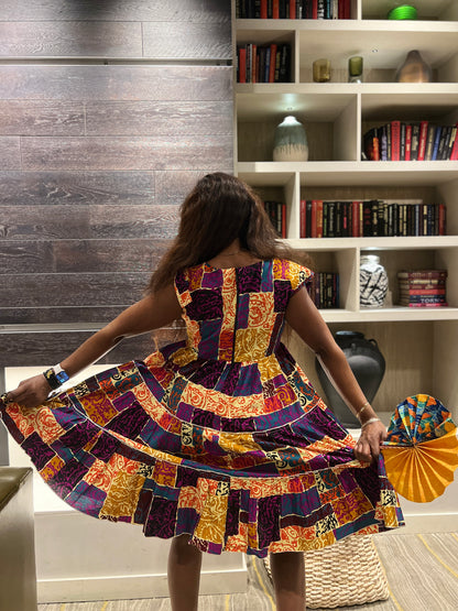 Nancy’s African wax Printed Multicolored Dress. purple and yellow. Dress with side pockets , short sleeves. 100% Cotton