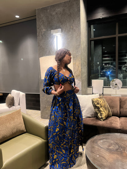 Malayka African printed  Maxi Skirt 2 pieces. Skirt with zipper slit on the side, two side pockets and long sleeves crop top. For parties, weddings, birthdays, and major social events.