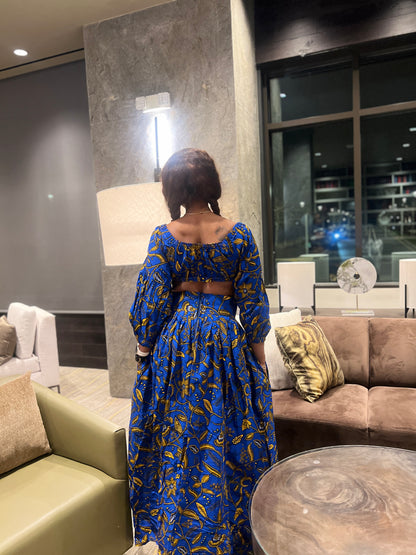 Malayka African printed  Maxi Skirt 2 pieces. Skirt with zipper slit on the side, two side pockets and long sleeves crop top. For parties, weddings, birthdays, and major social events.